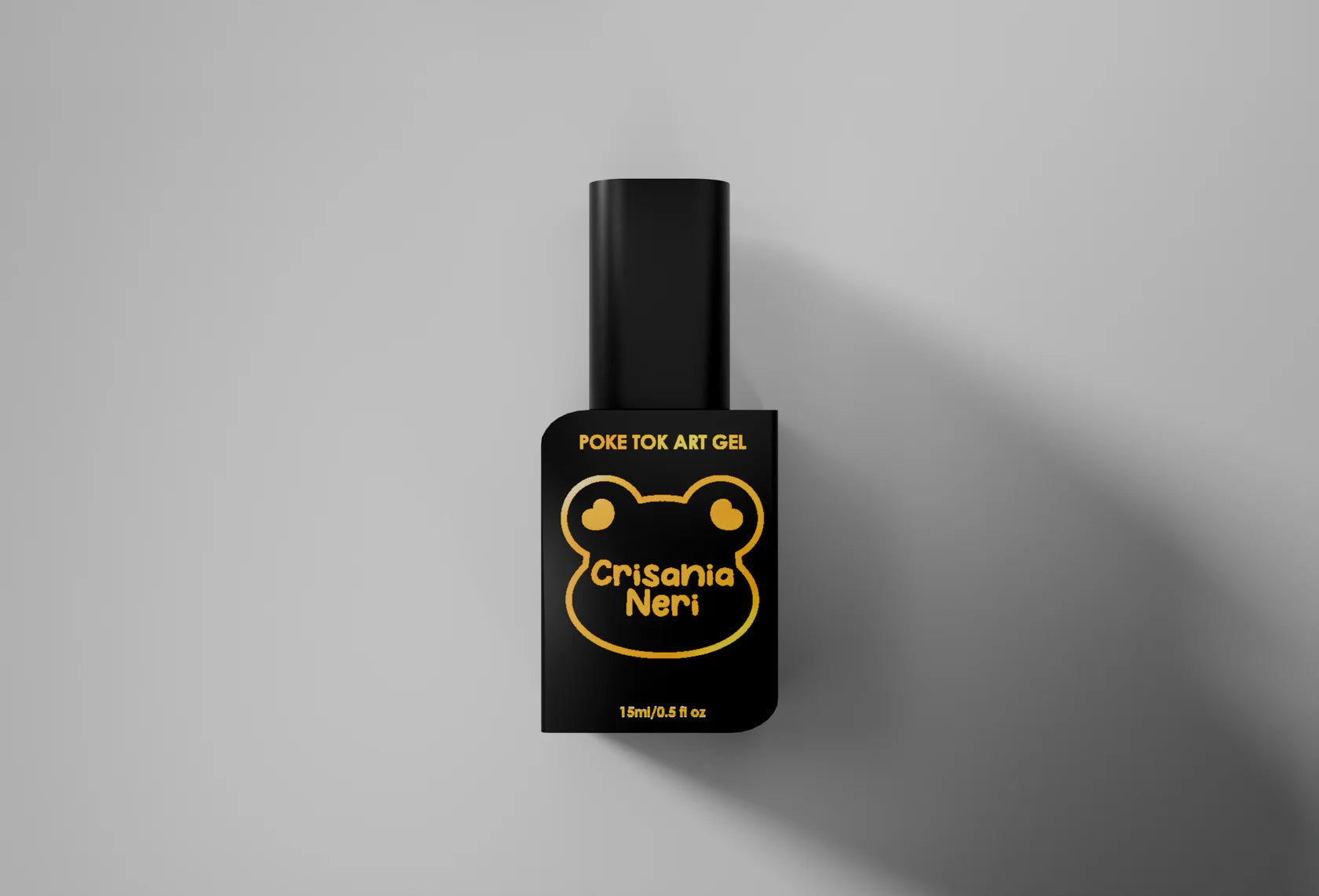 Black nail polish bottle with yellow text on a gray background